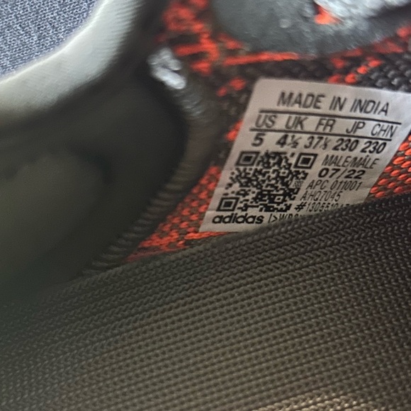 Yeezy Black and Orange Sneakers with Boost Cushioning - Picture 6 of 6